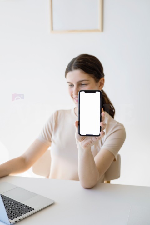 Woman Showing a Blank Screen of a Smartphone